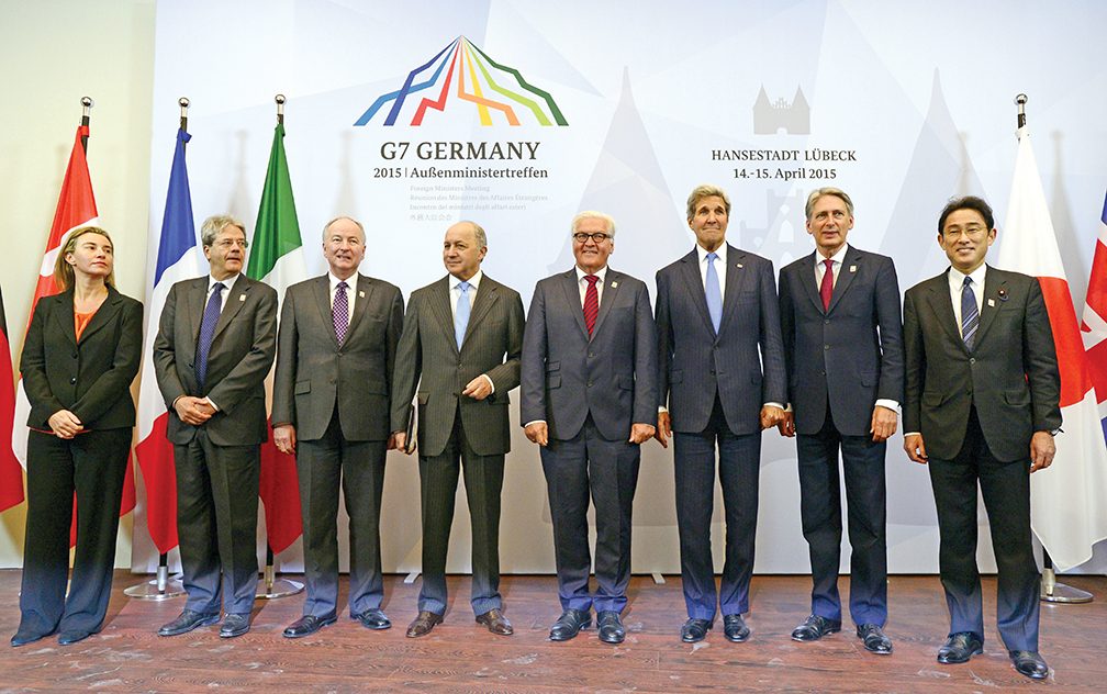 (L-R) High Representative of the European Union for Foreign Affairs and Security Policy Federica Mogherini, Italian Foreign Minister Paolo Gentiloni, Canadian Foreign Minister Rob Nicholson, French Foreign Minister Laurent Fabius, German Foreign Minister Frank-Walter Steinmeier, US Secretary of State John Kerry, British Foreign Secretary Philip Hammond and Japanese Foreign Minister Fumio Kishida pose for a family picture during a meeting of G7 foreign ministers in Luebeck, northern Germany, on April 15, 2015. The foreign ministers meet to discuss key global political and security issues ahead of a G7 summit to take place in June 2015 in southern Germany. The G7 is a grouping of the seven biggest economic powers in the world -- Germany, Canada, the United States, France, Italy, Japan, Britain -- excluding China. AFP PHOTO / JOHN MACDOUGALL (Photo credit should read JOHN MACDOUGALL/AFP/Getty Images)